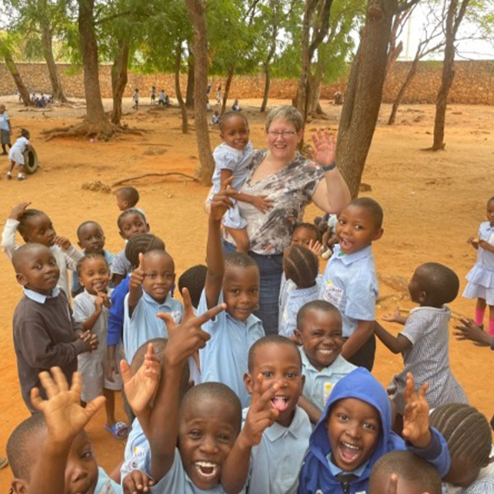 Image of Tanya from SoleLution with school children in Kenya