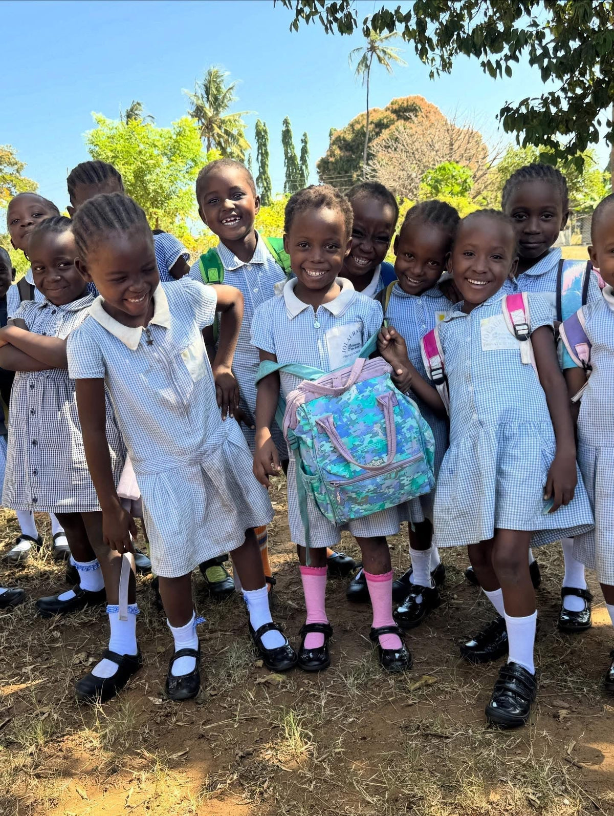 Some pupils from Jolaurabi School very happy with their new school shoes