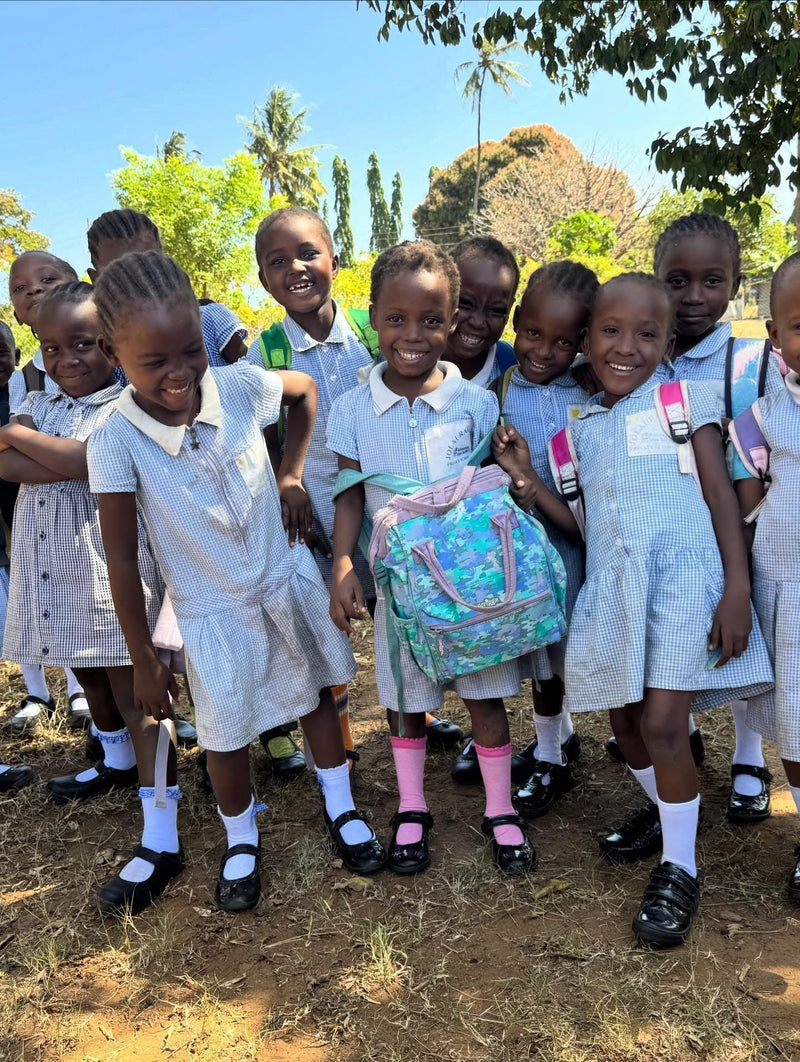 Some pupils from Jolaurabi School very happy with their new school shoes