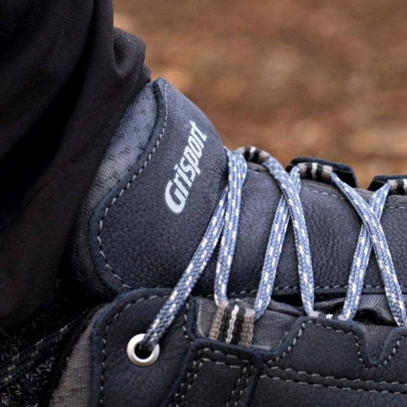 Close-up of a pair of Grisport hiking boots with blue laces.